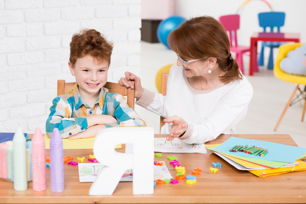 Children Therapist And Reading Lesson